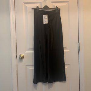 Selling this new ZARA satin black skirt in size XS. Never worn. New with tag.